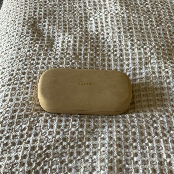 Gold rimmed sunglasses